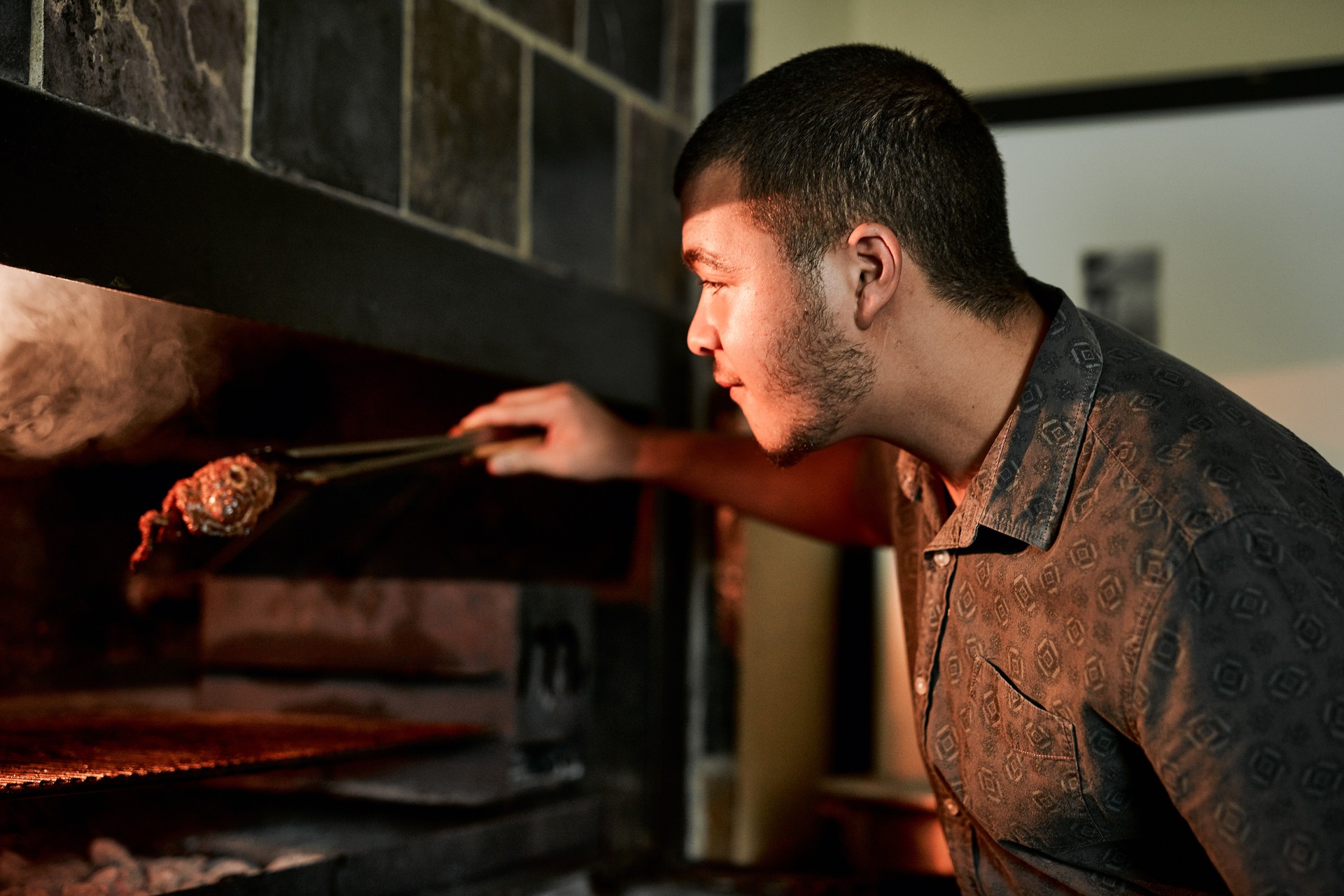 The man in charge of the barbecue